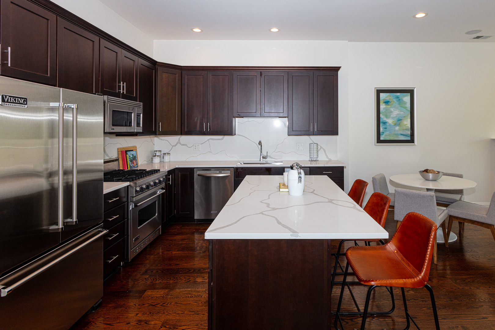 1838 West Rice Street, Unit 3 Chicago, IL 60622 - Photo 9 of 29 a kitchen with stainless steel appliances a stove a sink a microwave a refrigerator and cabinets