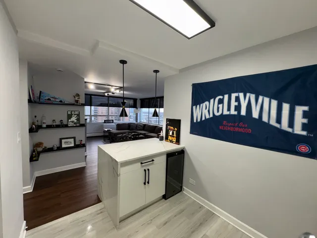 a kitchen with a sink a stove and cabinets