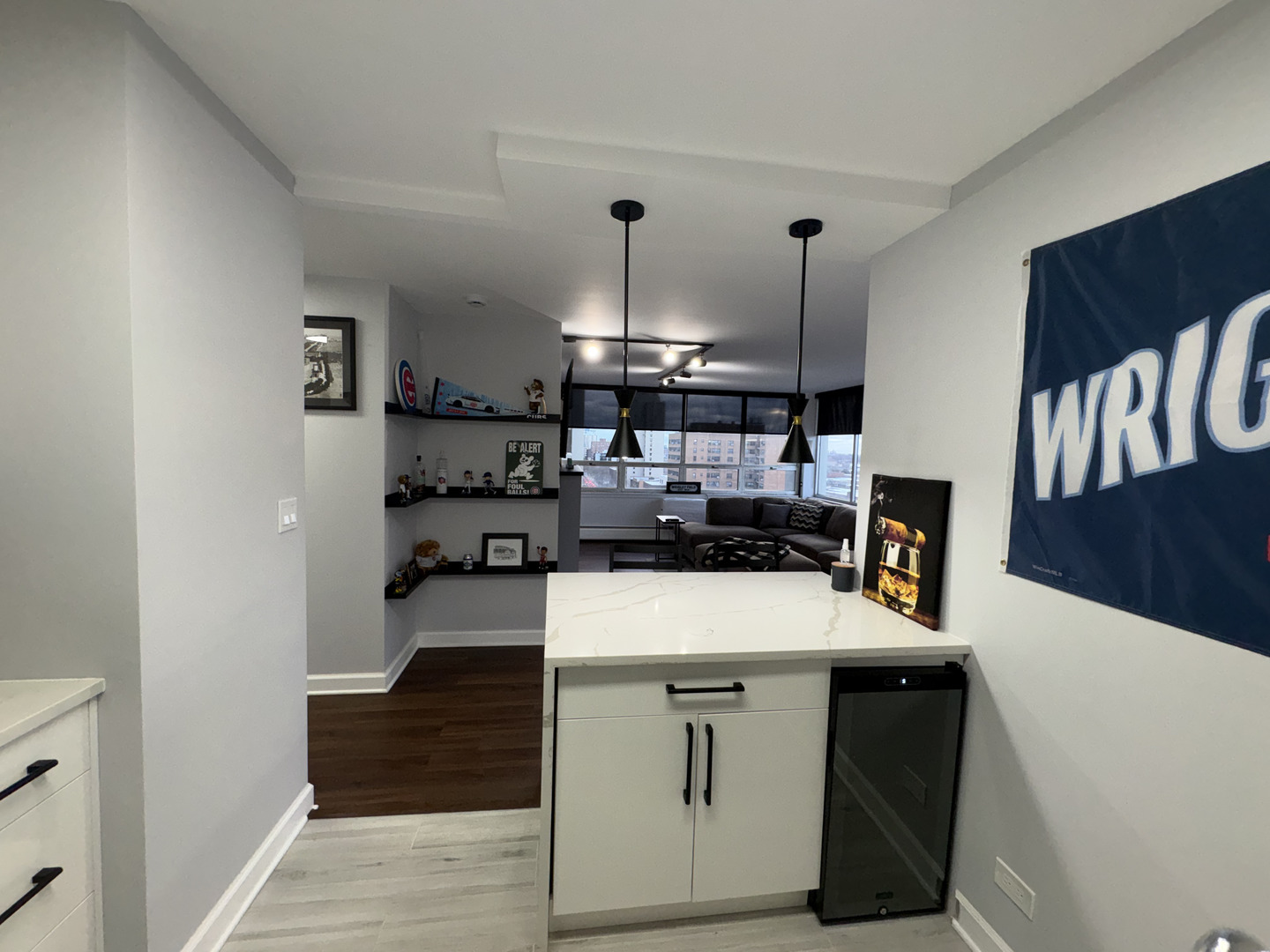 6171 North Sheridan Road, Unit 1102 Chicago, IL 60660 - Photo 19 of 39 a kitchen with a sink a stove and cabinets