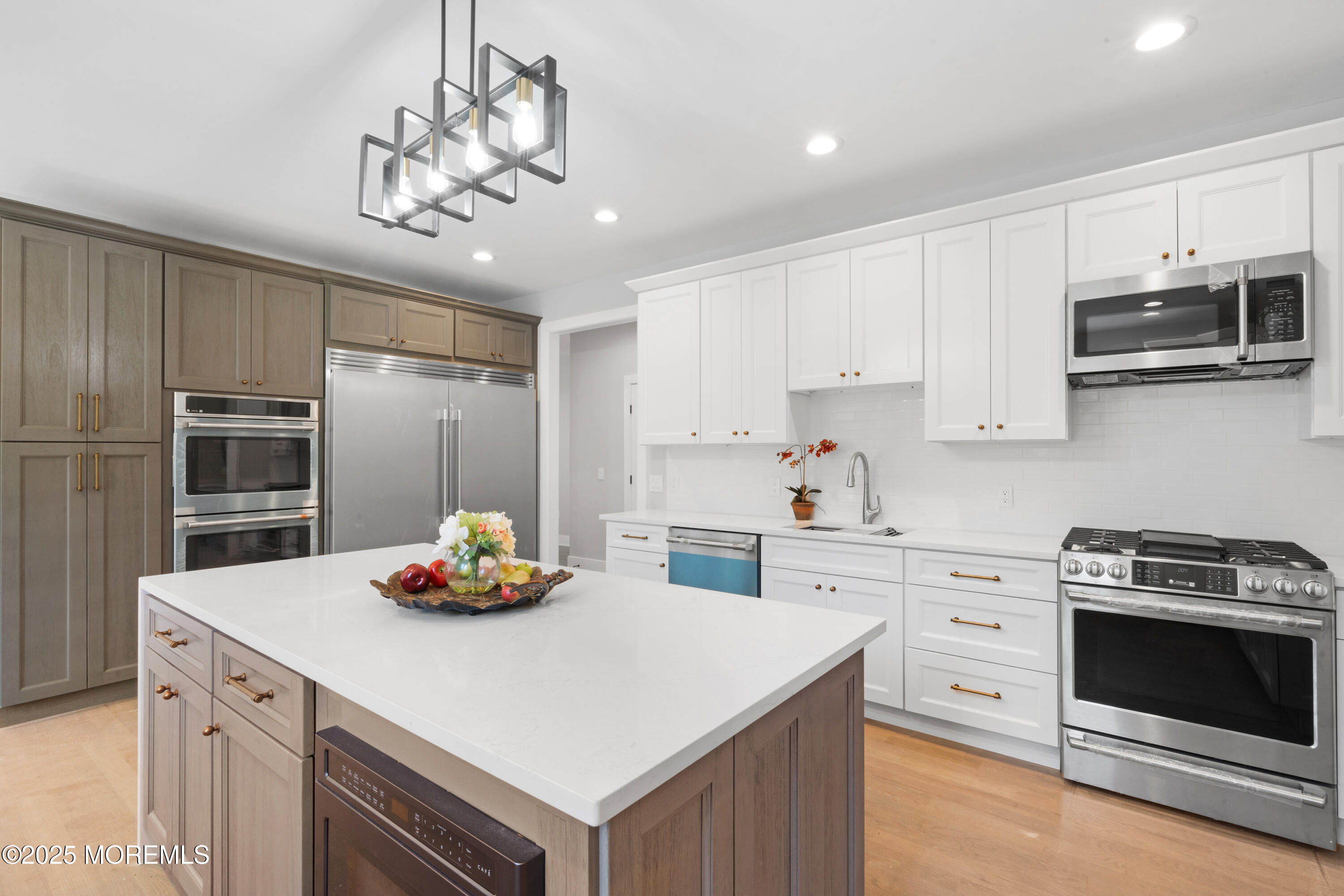 8 Haystack Court Howell, NJ 07731 - Photo 13 of 40 a kitchen with kitchen island a white cabinets and stainless steel appliances