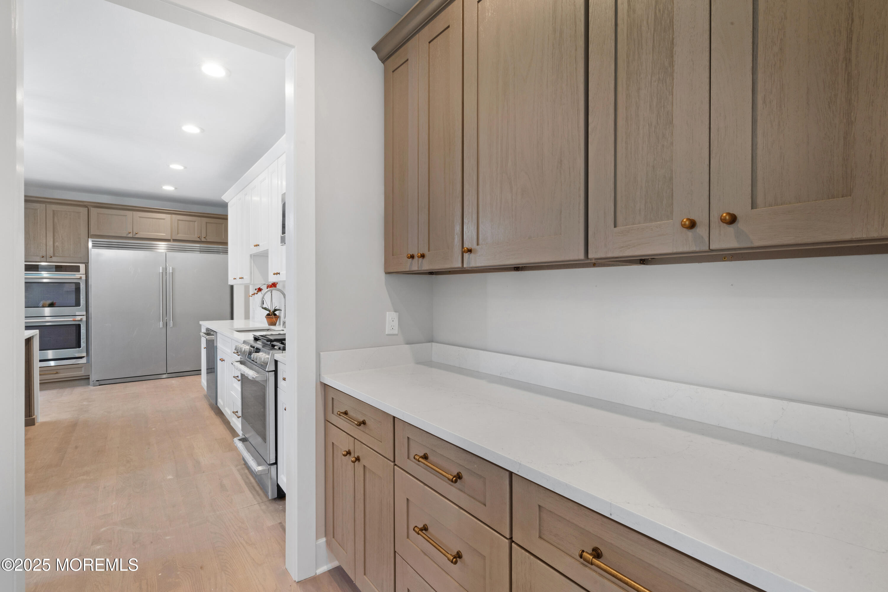 8 Haystack Court Howell, NJ 07731 - Photo 15 of 40 a kitchen with stainless steel appliances granite countertop a refrigerator and a sink