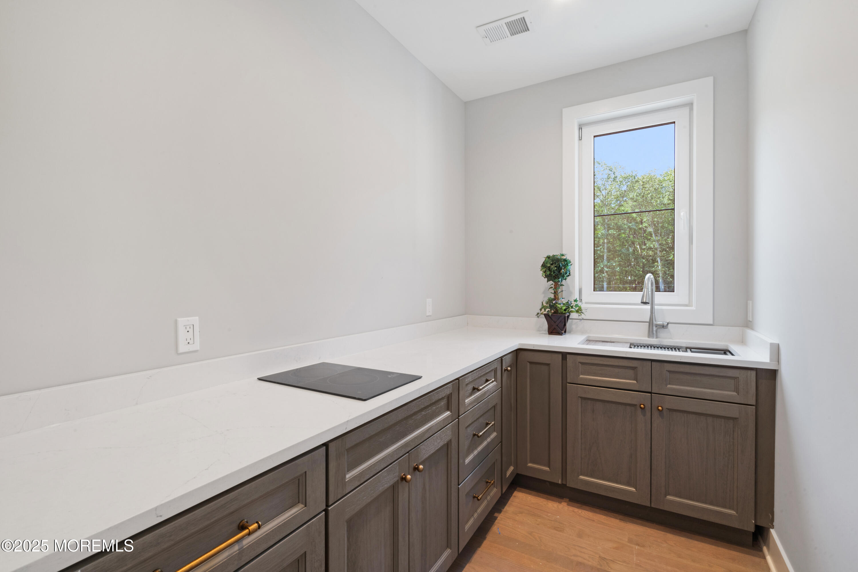 8 Haystack Court Howell, NJ 07731 - Photo 16 of 40 a kitchen with a sink and cabinets