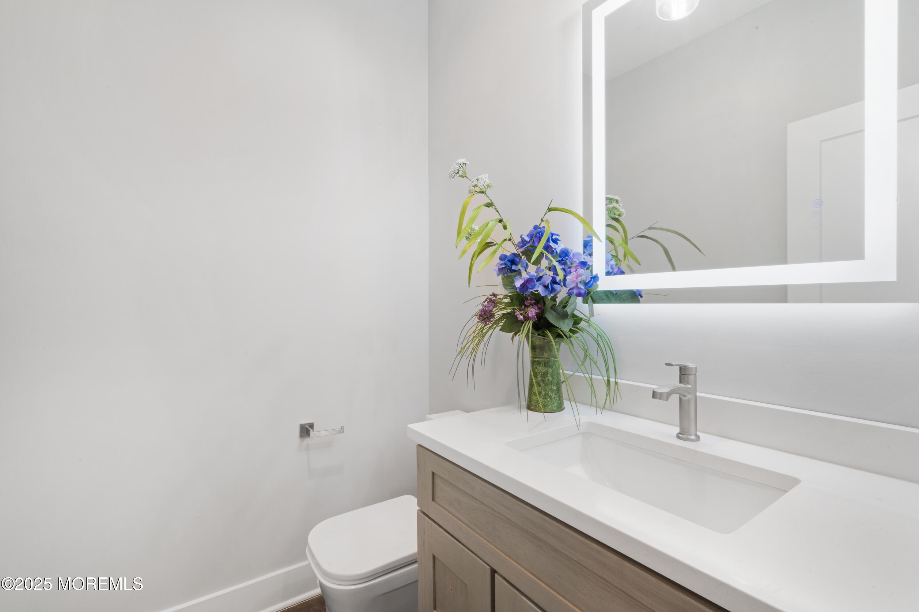 8 Haystack Court Howell, NJ 07731 - Photo 17 of 40 a bathroom with a sink a toilet and a mirror