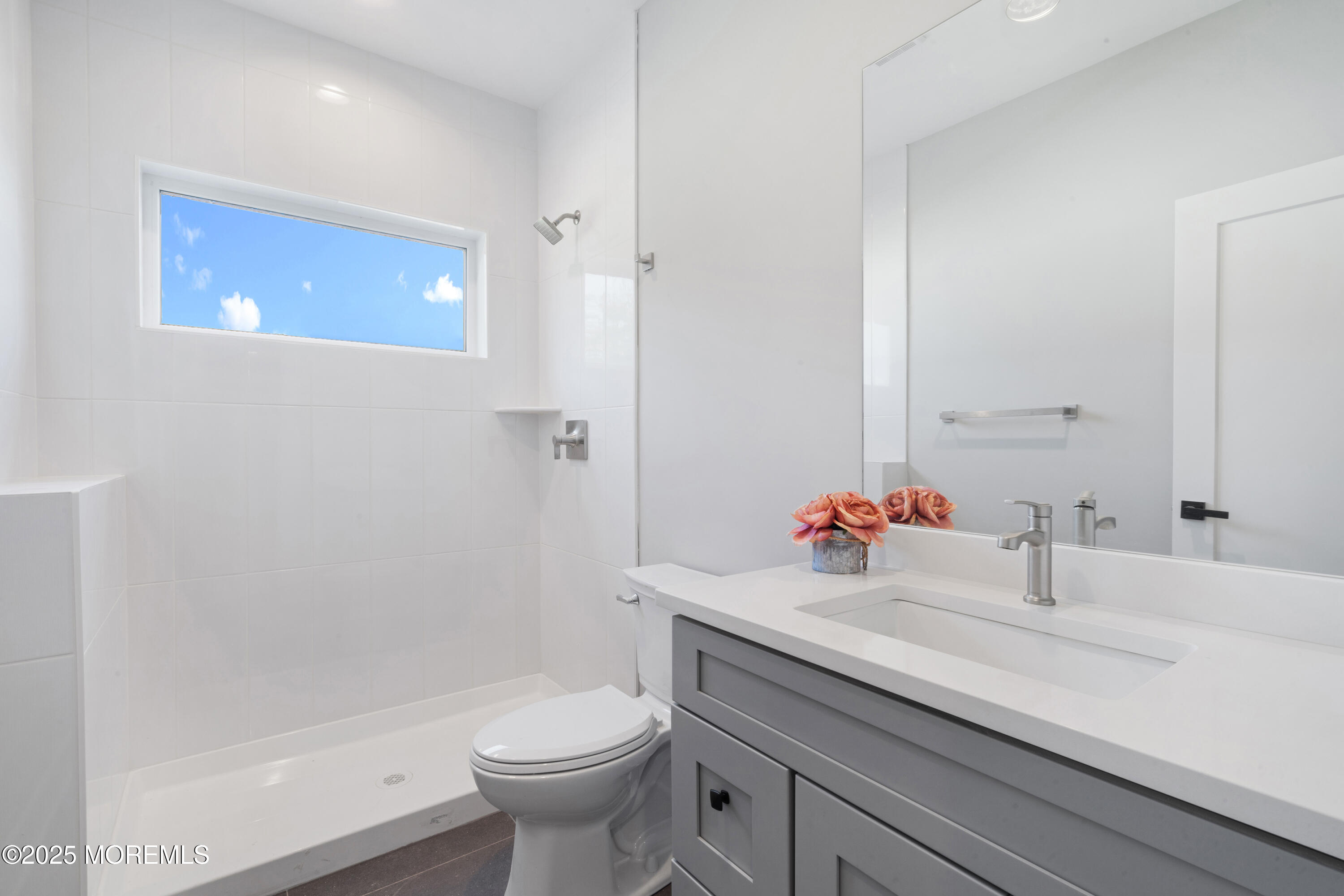 8 Haystack Court Howell, NJ 07731 - Photo 22 of 40 a bathroom with a sink a toilet and shower