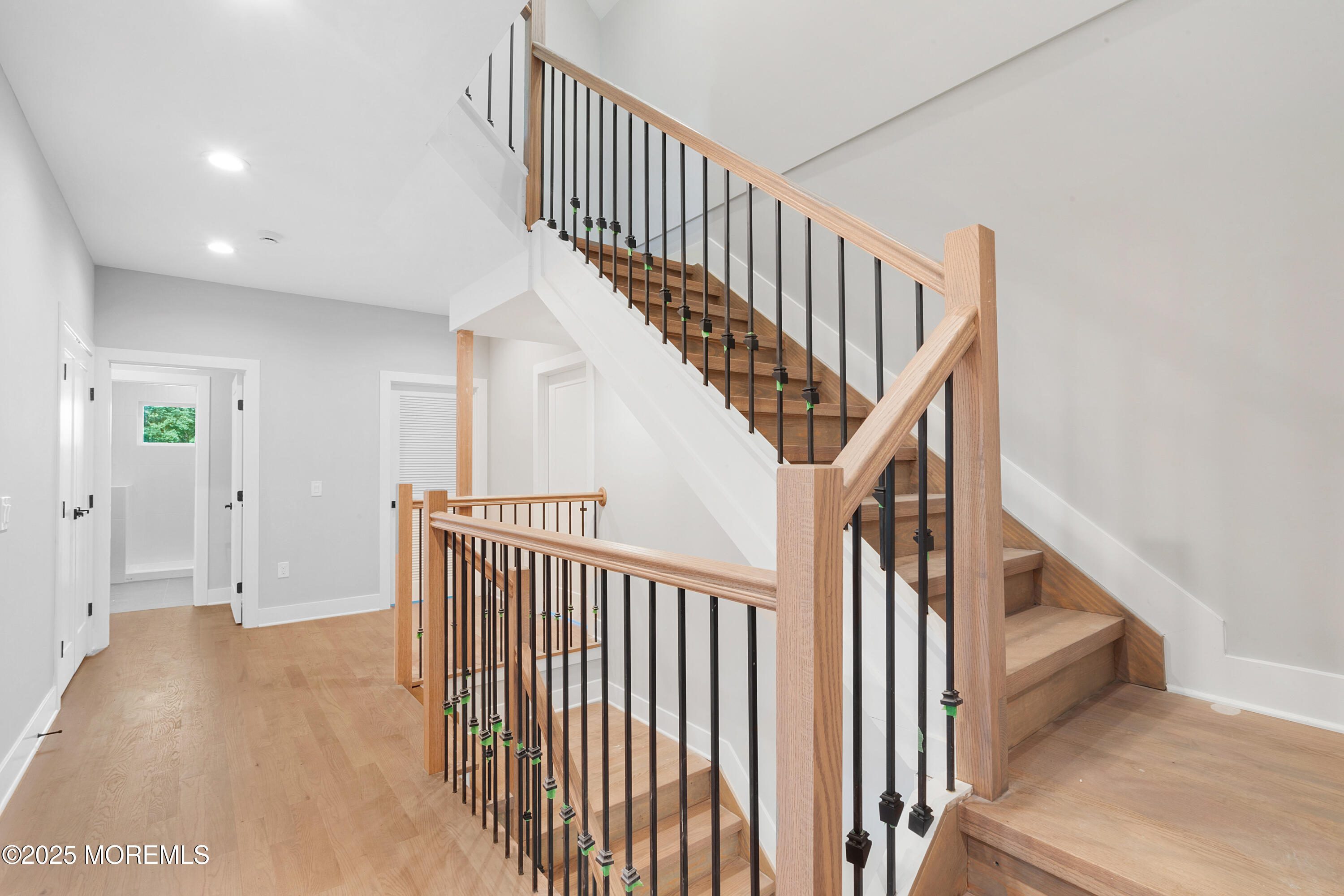 8 Haystack Court Howell, NJ 07731 - Photo 23 of 40 a view of staircase with railing and white walls