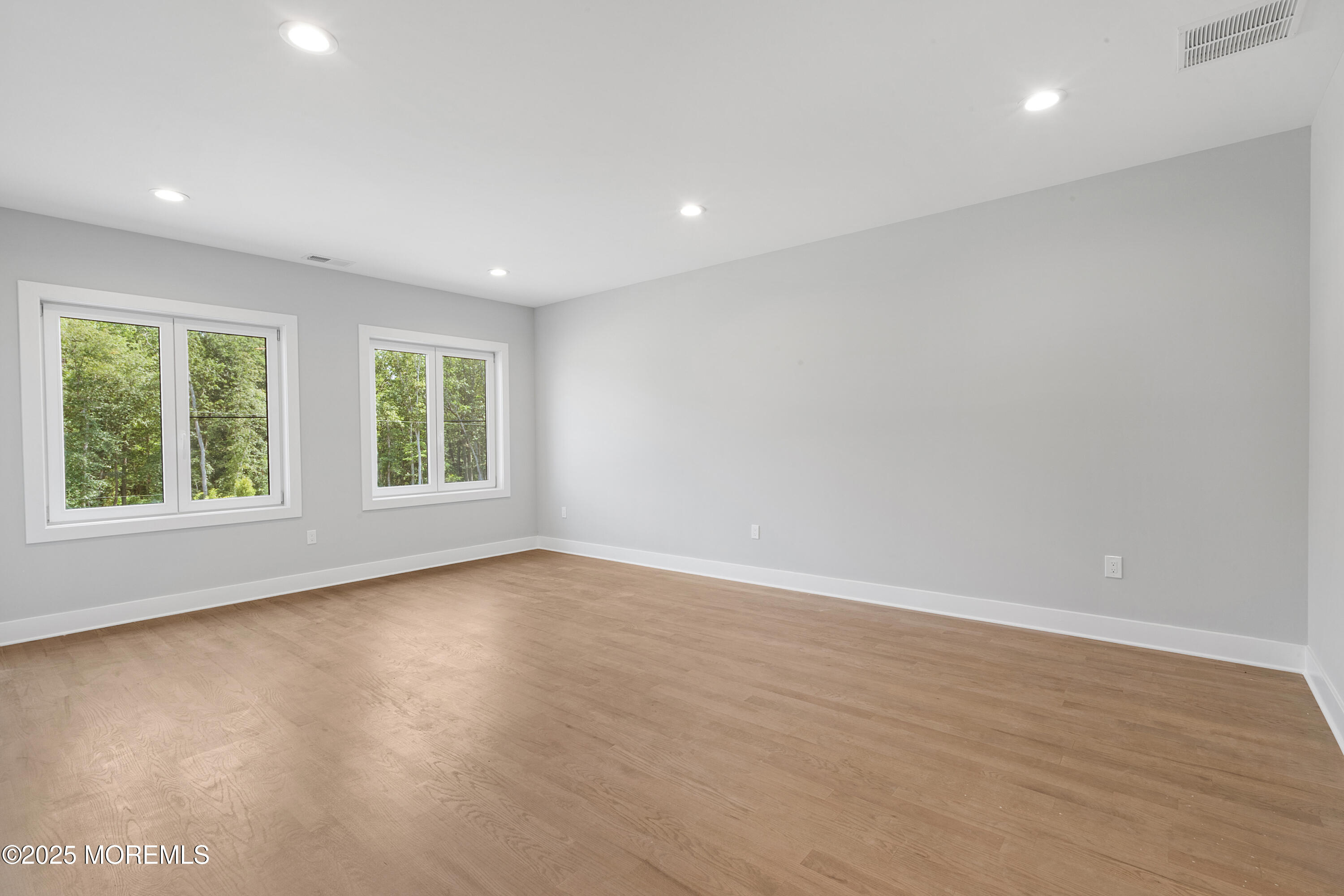 8 Haystack Court Howell, NJ 07731 - Photo 25 of 40 an empty room with wooden floor and windows