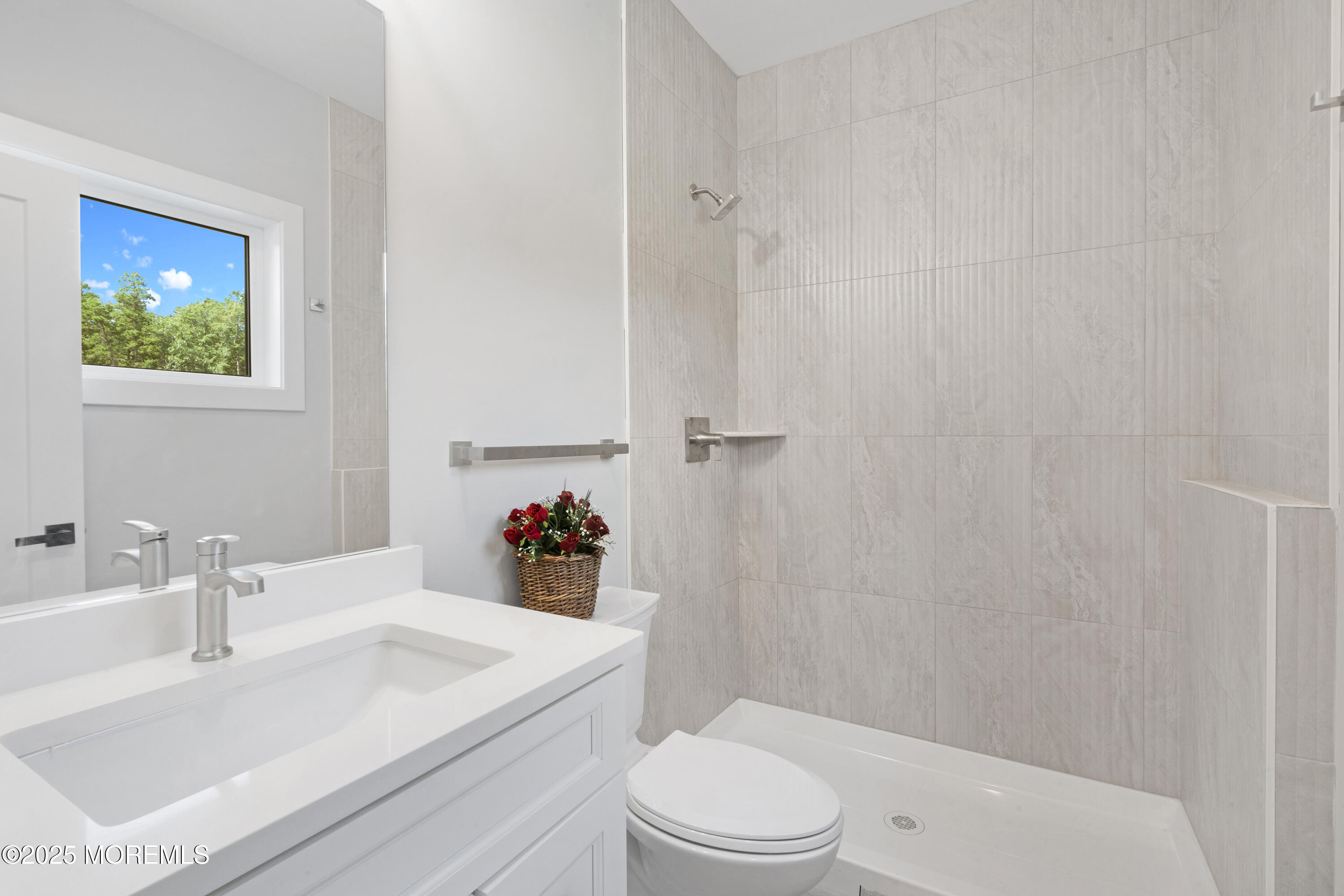 8 Haystack Court Howell, NJ 07731 - Photo 26 of 40 a bathroom with a sink a toilet and shower