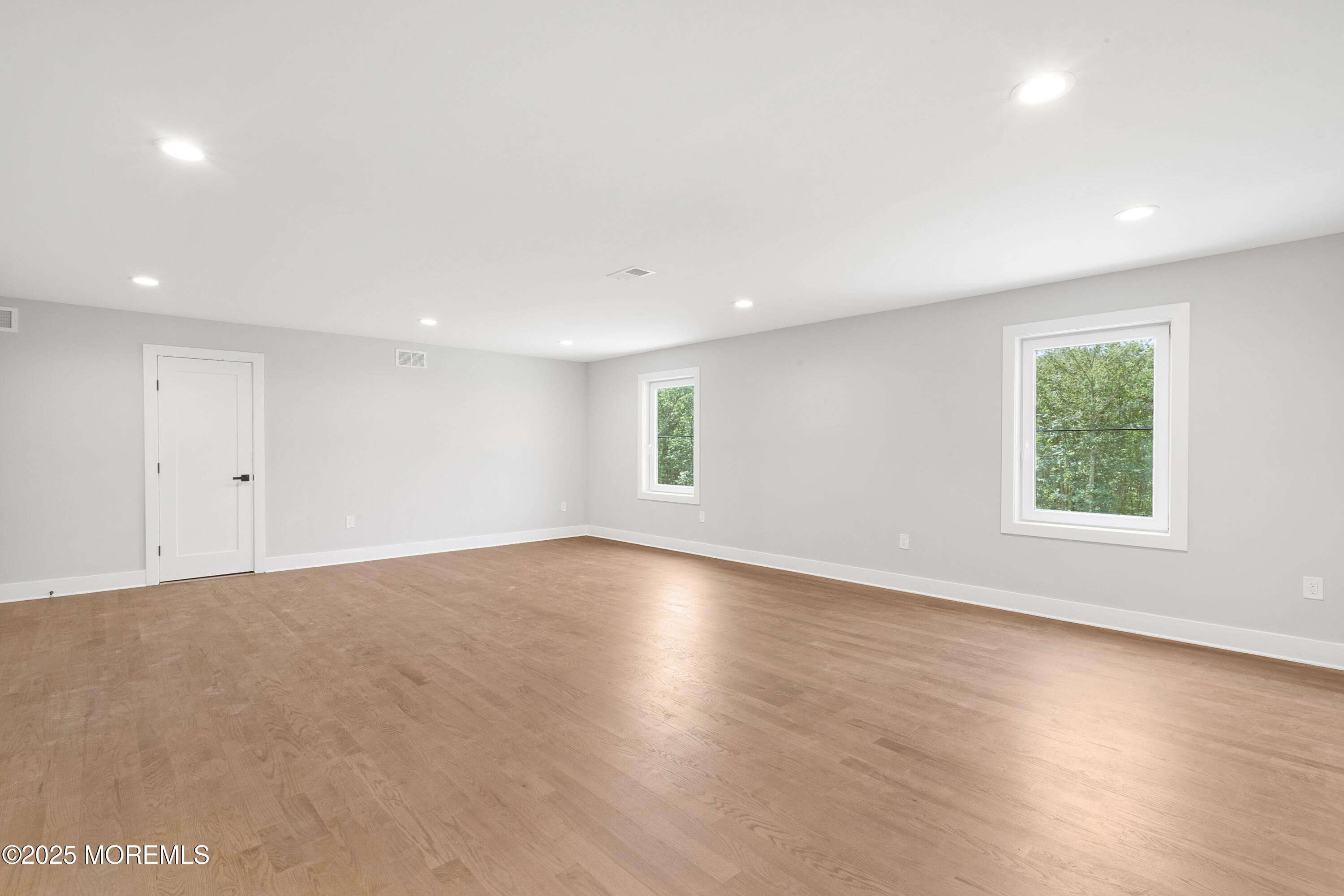 8 Haystack Court Howell, NJ 07731 - Photo 32 of 40 an empty room with wooden floor and windows