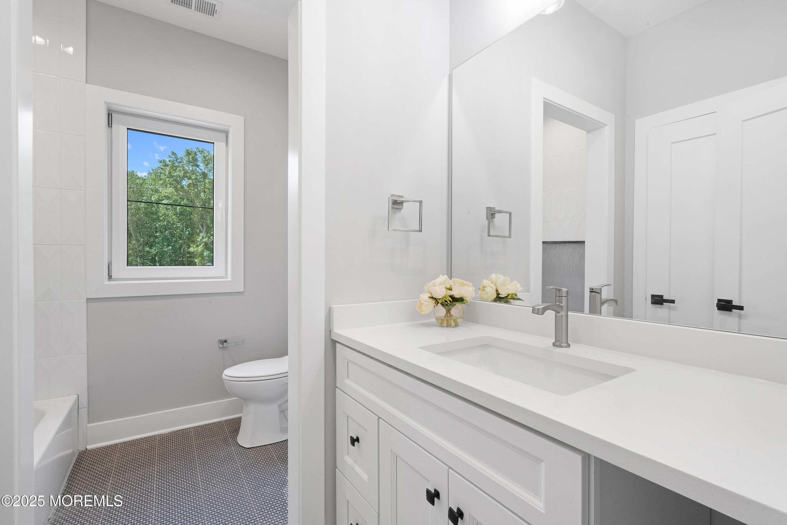 8 Haystack Court Howell, NJ 07731 - Photo 33 of 40 a bathroom with a sink toilet and a mirror