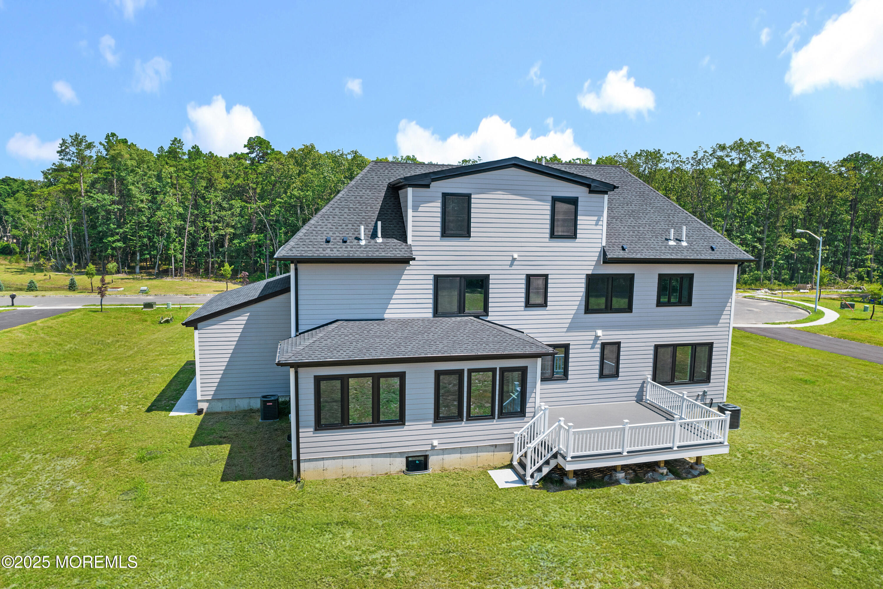 8 Haystack Court Howell, NJ 07731 - Photo 38 of 40 a front view of a house with a garden and swimming pool