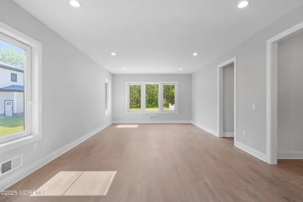 a front view of a house with a garden and swimming pool