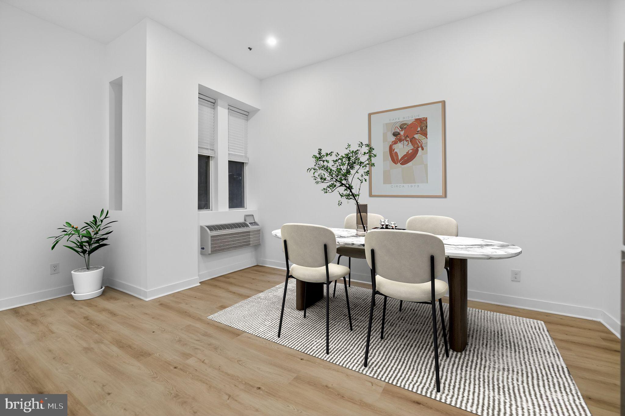 1415 Chapin Street Northwest, Unit 108 Washington, DC 20009 - Photo 4 of 12 a view of a dining room with furniture and wooden floor