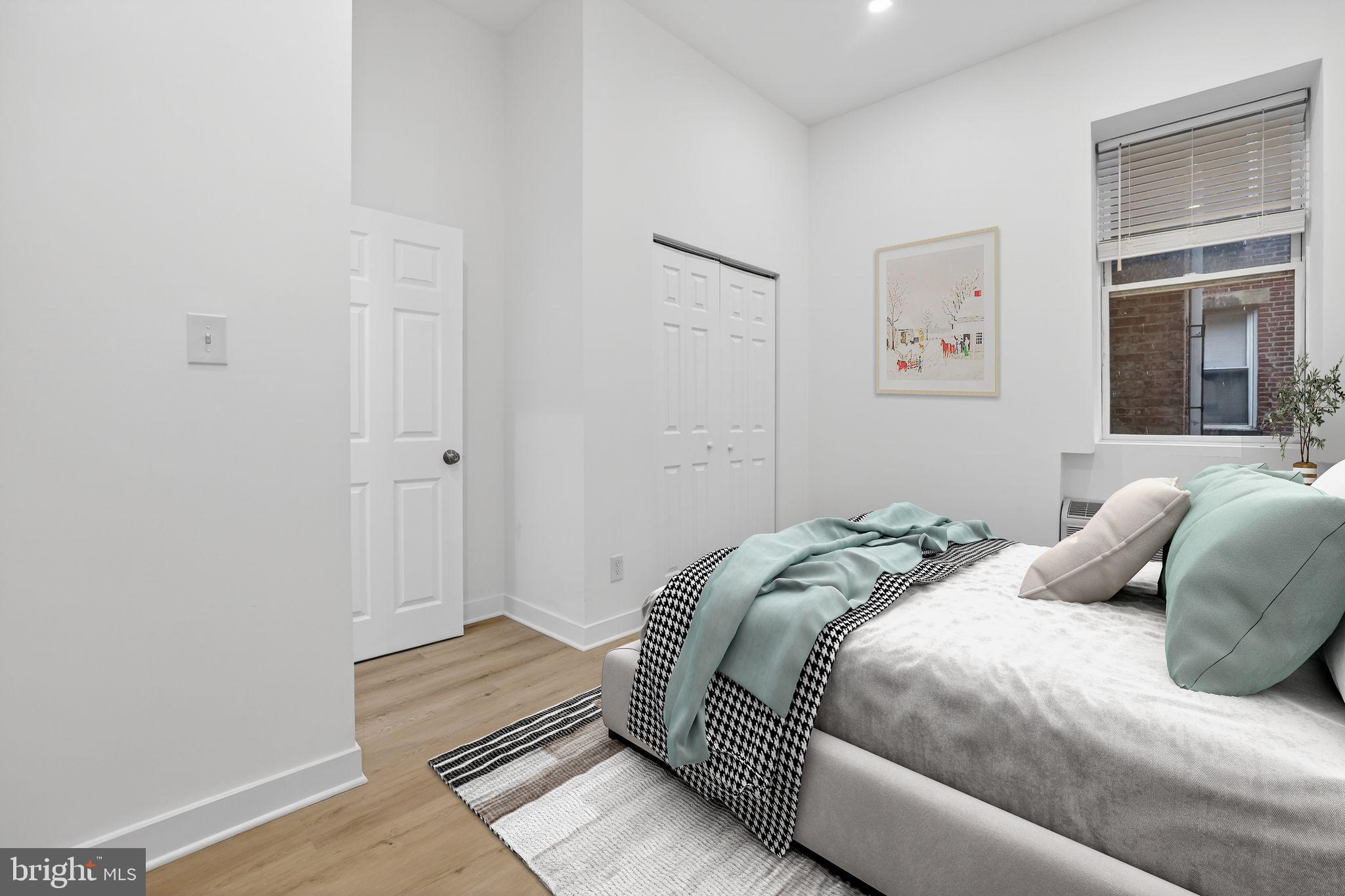 1415 Chapin Street Northwest, Unit 108 Washington, DC 20009 - Photo 7 of 12 a bedroom with a bed and a window