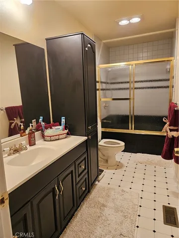 a bathroom with a sink double vanity and a shower