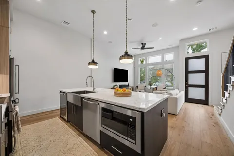 a kitchen that has a sink and a stove