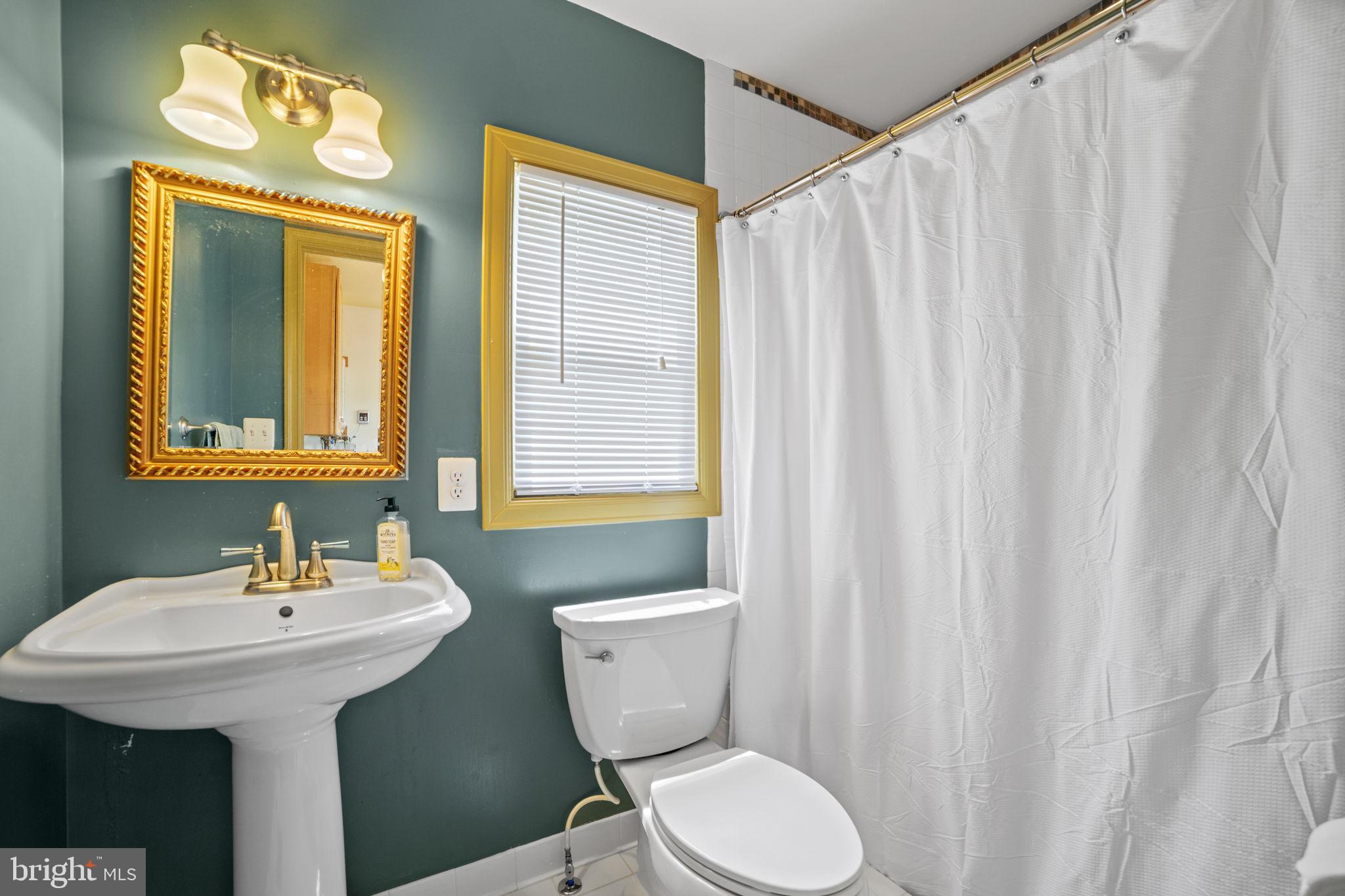 705 Dranesville Road Herndon, VA 20170 - Photo 13 of 22 Chic bathroom with elegant accents.