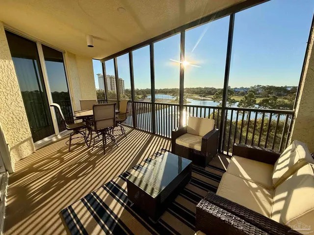 a view of balcony with couch and wooden floor