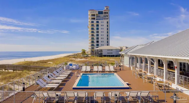 a view of a swimming pool with an ocean view