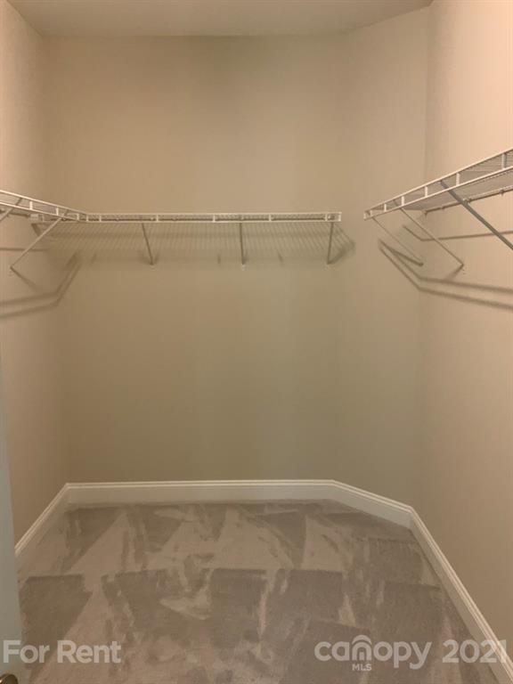 3028 Fallondale Road, Unit 894 Waxhaw, NC 28173 - Photo 13 of 27 a view of a room with racks on the wall