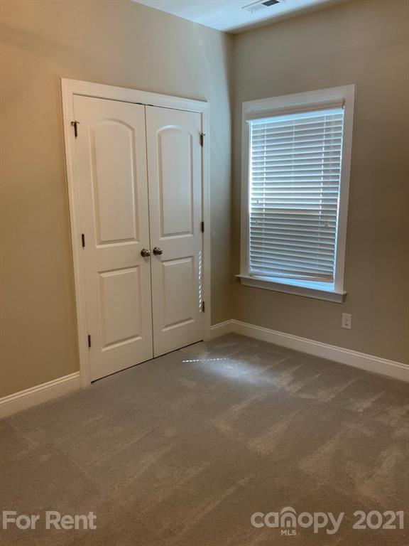 3028 Fallondale Road, Unit 894 Waxhaw, NC 28173 - Photo 15 of 27 a view of an empty room with a window