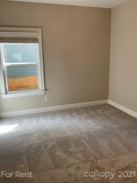 3028 Fallondale Road, Unit 894 Waxhaw, NC 28173 - Photo 16 of 27 an empty room with a window