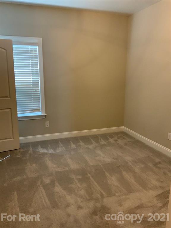 3028 Fallondale Road, Unit 894 Waxhaw, NC 28173 - Photo 20 of 27 a view of an empty room with a window