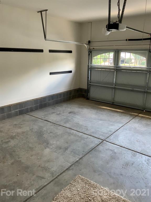 3028 Fallondale Road, Unit 894 Waxhaw, NC 28173 - Photo 22 of 27 a view of room that has a garage
