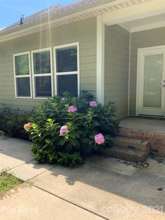 3028 Fallondale Road, Unit 894 Waxhaw, NC 28173 - Photo 27 of 27 a bunch of flowers in front of the house