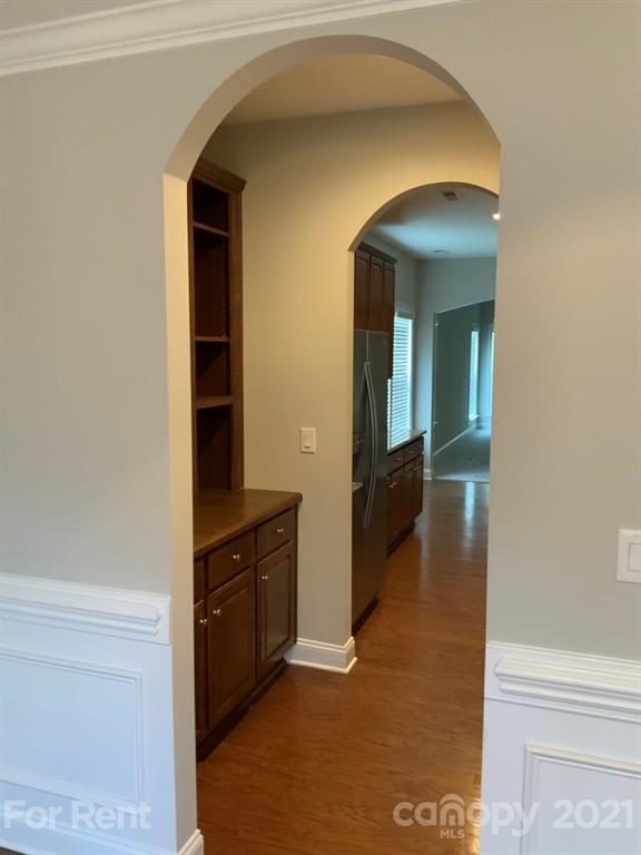 3028 Fallondale Road, Unit 894 Waxhaw, NC 28173 - Photo 4 of 27 a view of a hallway view with wooden floor and staircase