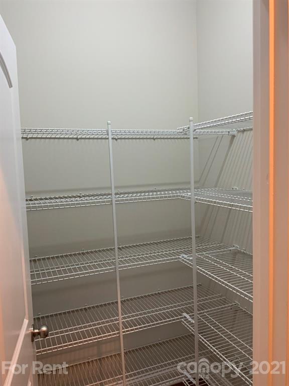 3028 Fallondale Road, Unit 894 Waxhaw, NC 28173 - Photo 5 of 27 a bathroom with a glass shower door