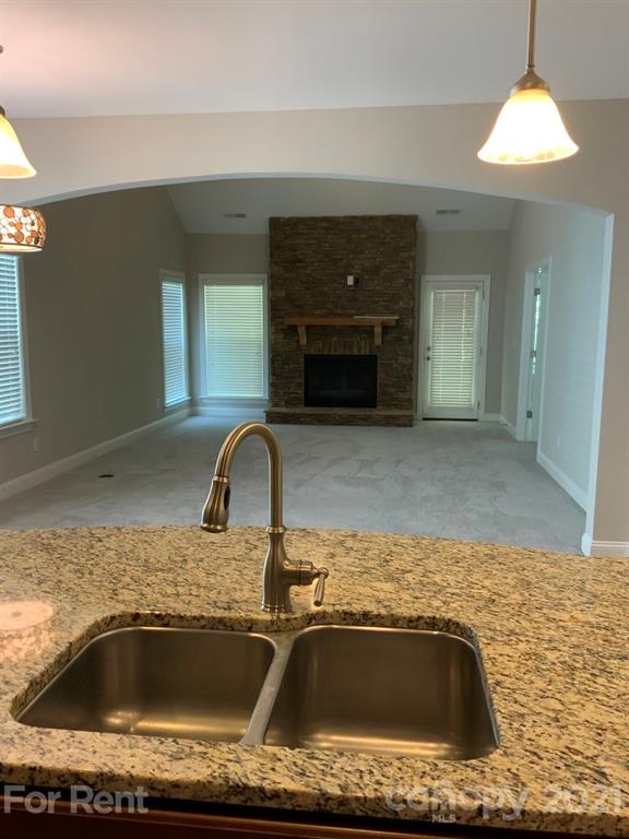 3028 Fallondale Road, Unit 894 Waxhaw, NC 28173 - Photo 7 of 27 a kitchen with a sink and a stove