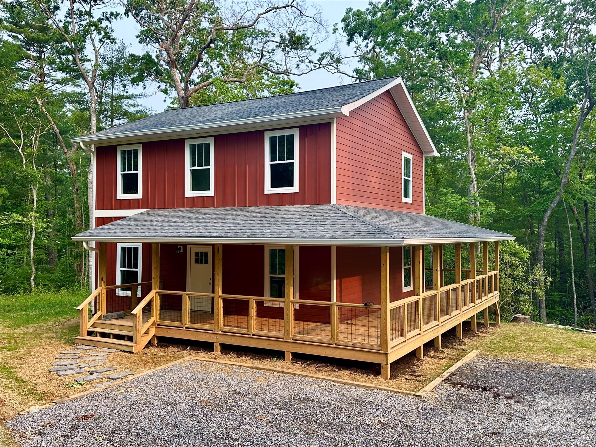 206 Cascade Rdg Road Fairview, NC 28730 - Photo 2 of 38 a view of a house with a yard porch and wooden fence