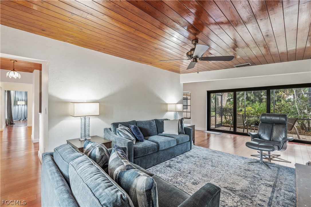 3209 West Riverside Drive Fort Myers, FL 33901 - Photo 15 of 31 a living room with furniture and a large window