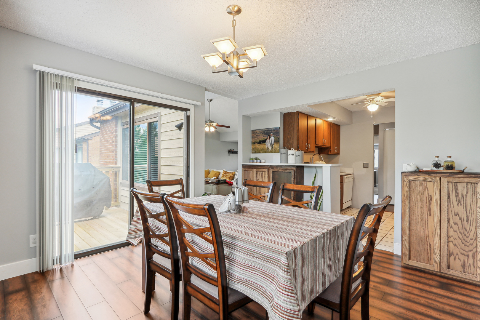 2143 Harbor Town Circle Champaign, IL 61821 - Photo 11 of 29 a dining room with furniture a chandelier and wooden floor