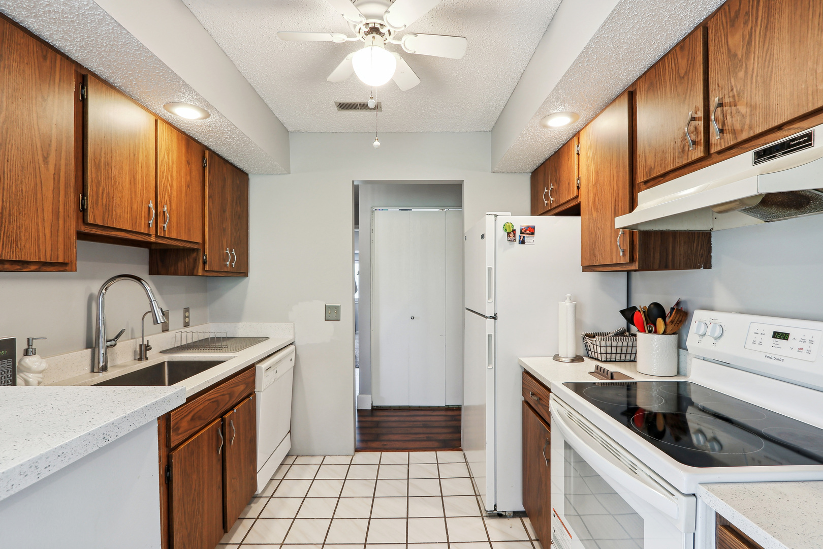 2143 Harbor Town Circle Champaign, IL 61821 - Photo 13 of 29 a kitchen with a sink cabinets and window
