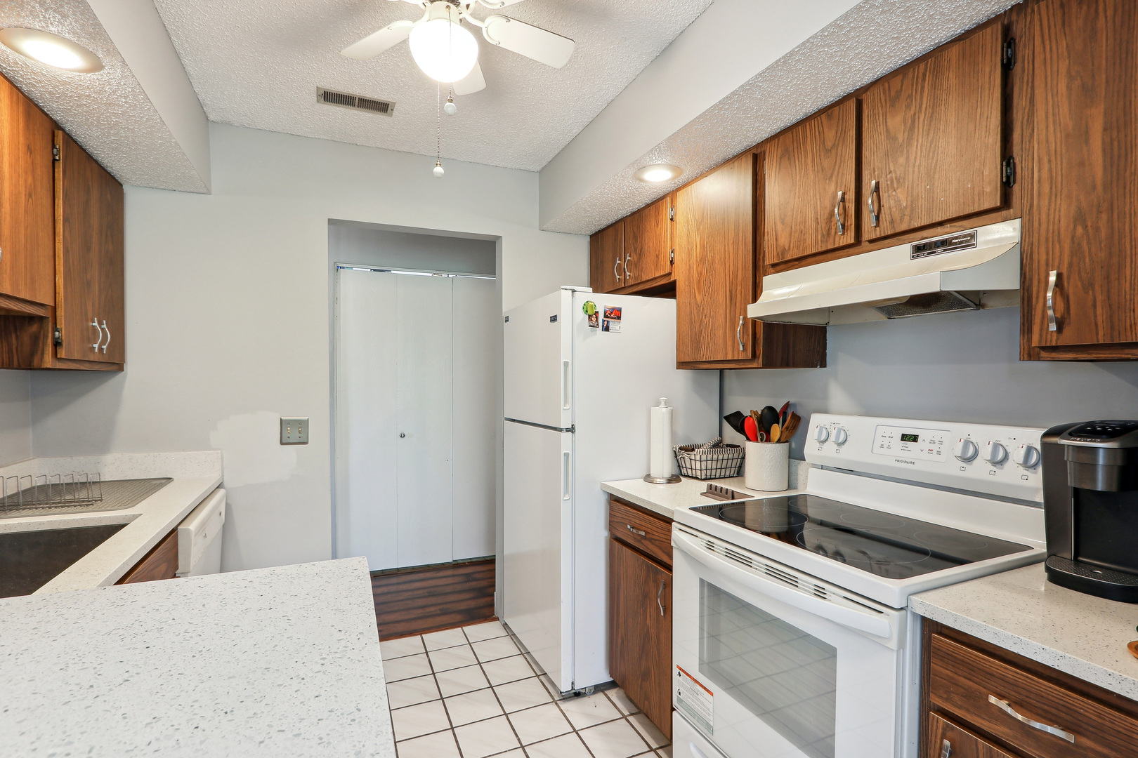 2143 Harbor Town Circle Champaign, IL 61821 - Photo 14 of 29 a kitchen with stainless steel appliances a stove a refrigerator and cabinets