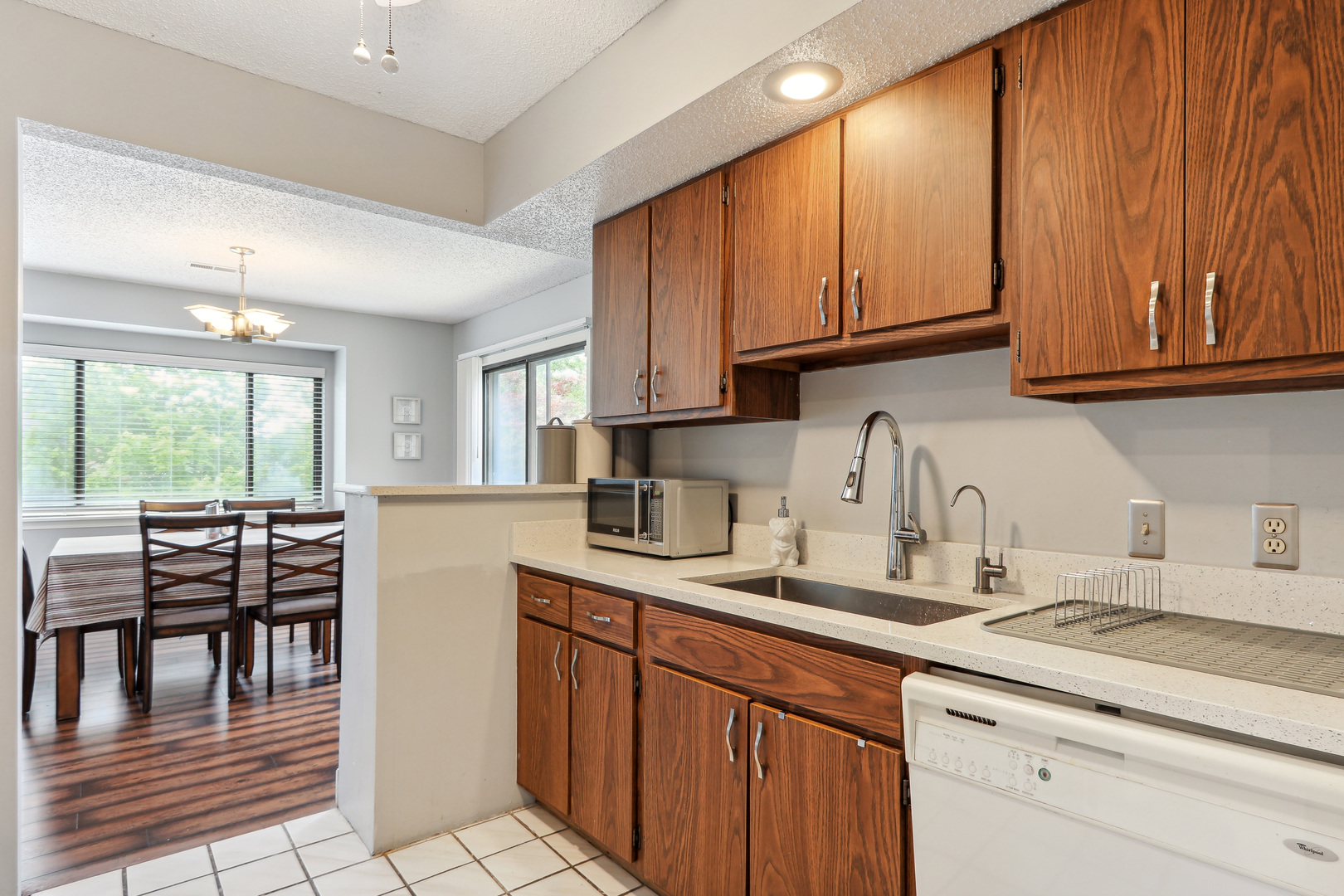 2143 Harbor Town Circle Champaign, IL 61821 - Photo 15 of 29 a kitchen with stainless steel appliances granite countertop a sink a stove and cabinets