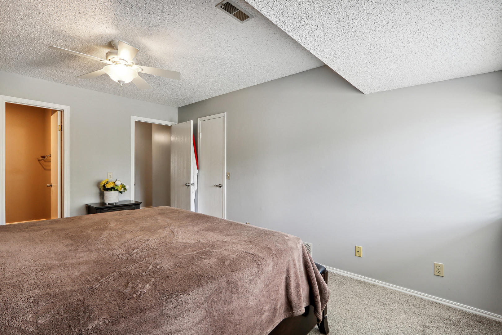 2143 Harbor Town Circle Champaign, IL 61821 - Photo 17 of 29 a bedroom with a large bed and a chandelier