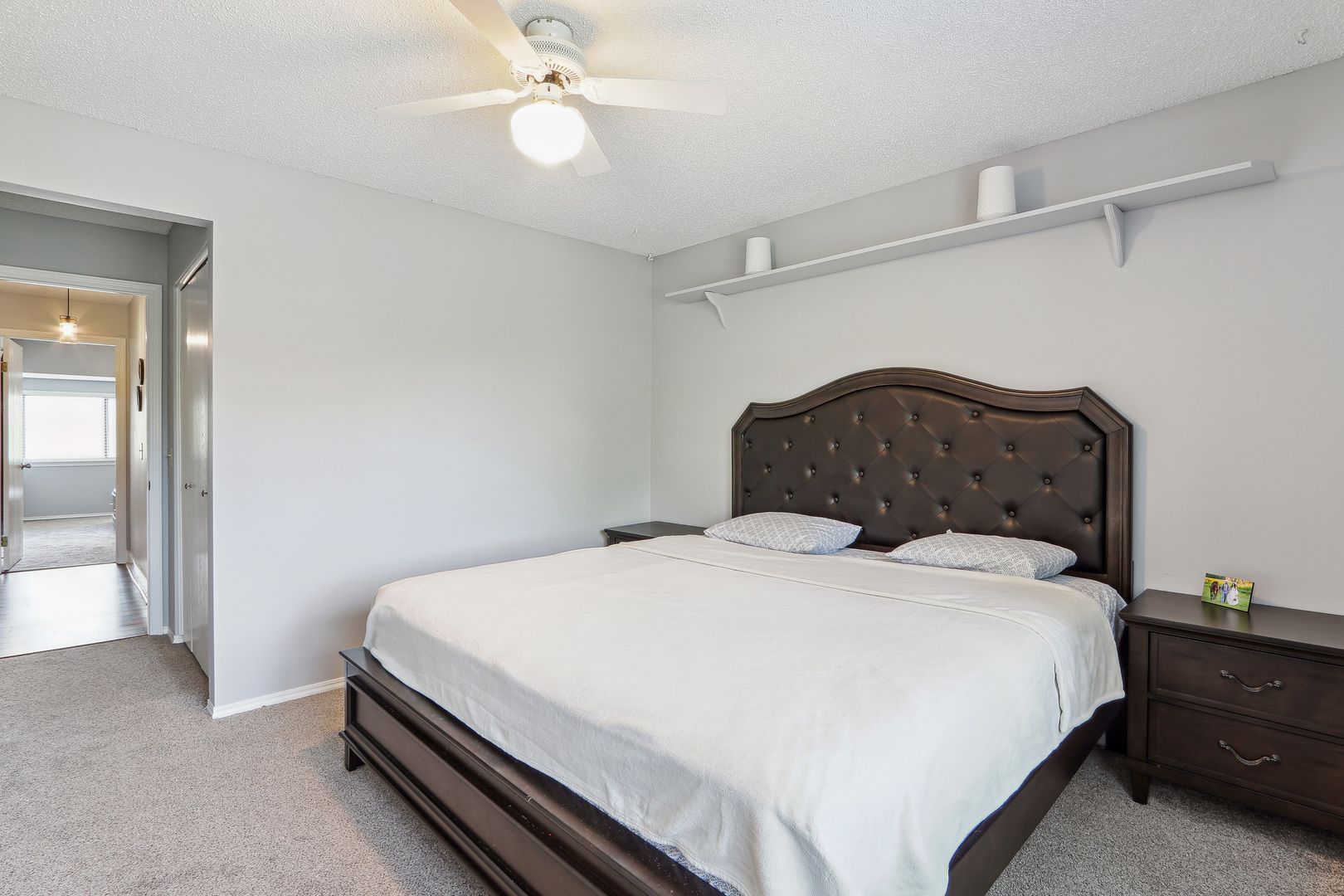 2143 Harbor Town Circle Champaign, IL 61821 - Photo 21 of 29 a bedroom with a bed and a chandelier