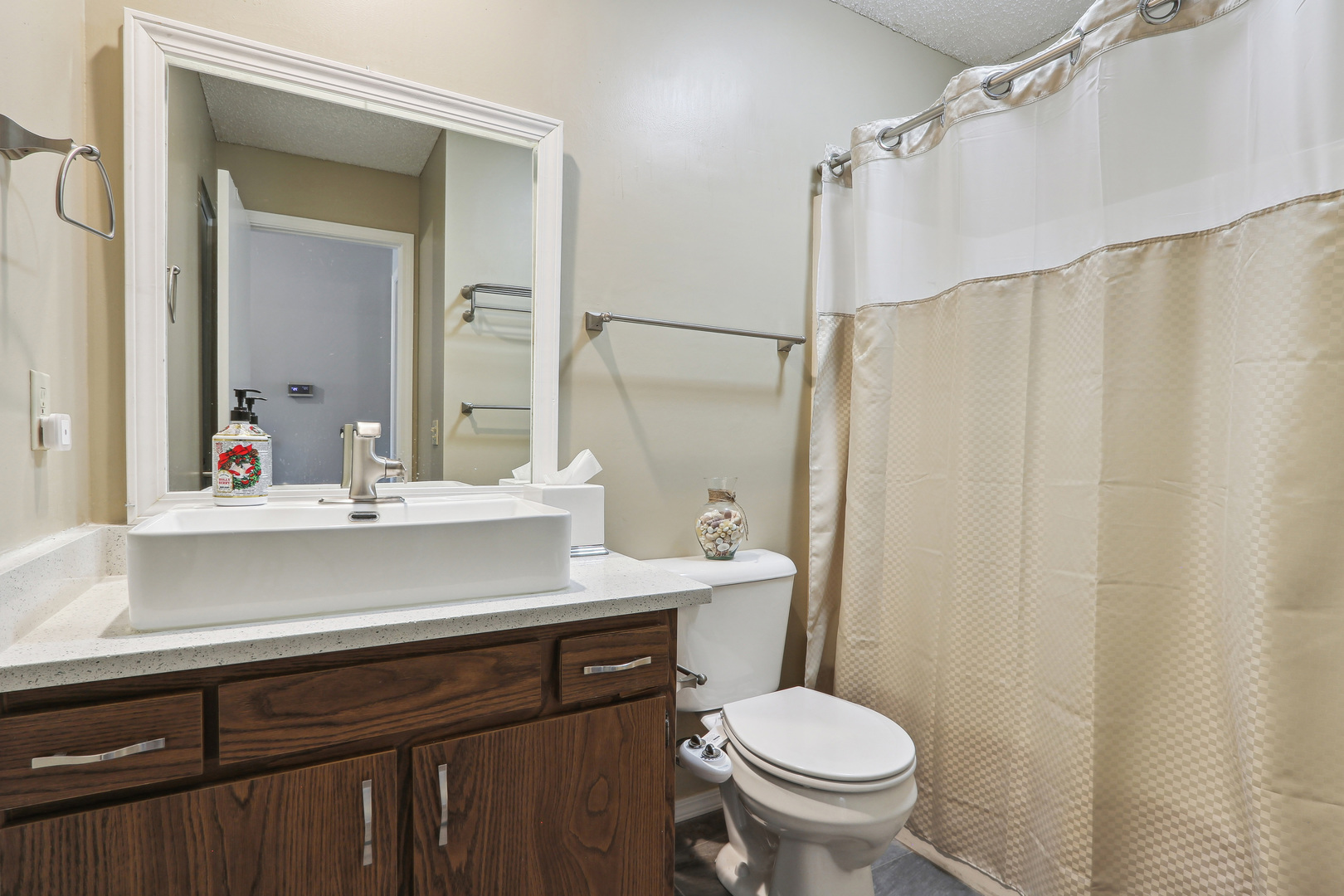 2143 Harbor Town Circle Champaign, IL 61821 - Photo 24 of 29 a bathroom with a sink a toilet a mirror and shower curtain