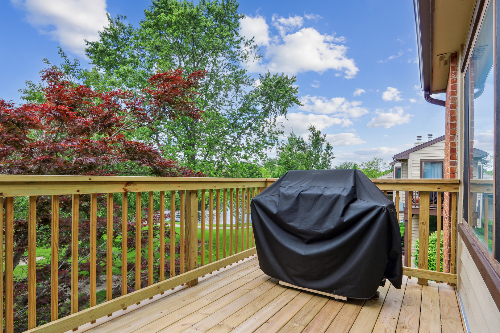 2143 Harbor Town Circle Champaign, IL 61821 - Photo 26 of 29 a view of balcony with wooden floor and fence