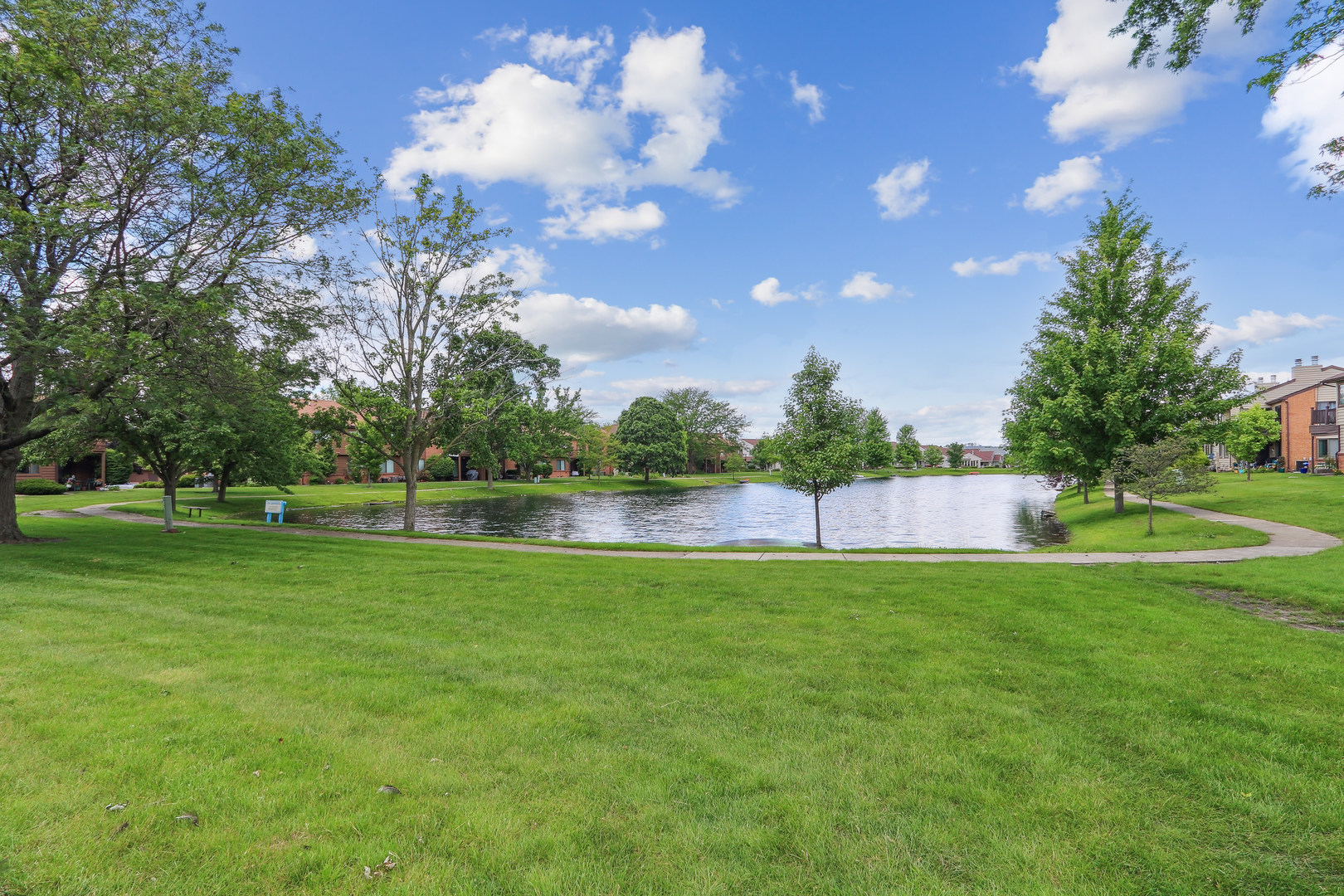 2143 Harbor Town Circle Champaign, IL 61821 - Photo 27 of 29 a view of a golf course with a lake