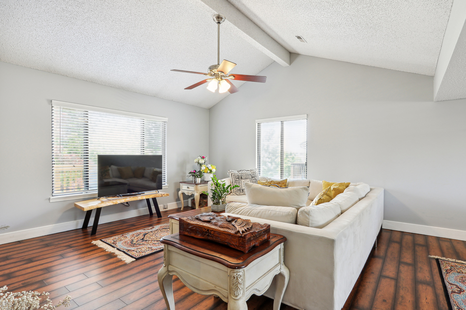 2143 Harbor Town Circle Champaign, IL 61821 - Photo 10 of 29 a living room with furniture a fireplace and a flat screen tv