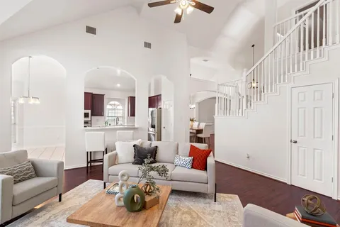 a living room with furniture and a rug
