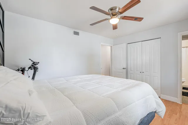 a large white bed in a white room