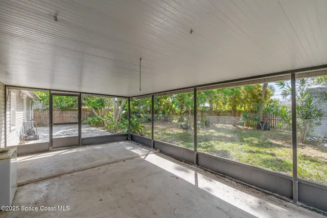 a view of a room with a large window