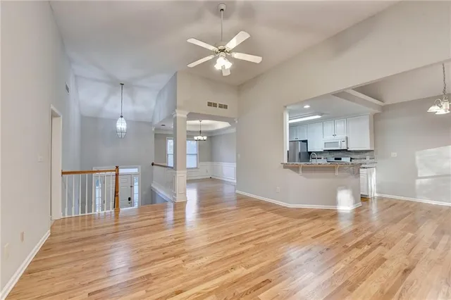 a view of kitchen with cabinets and wooden floor