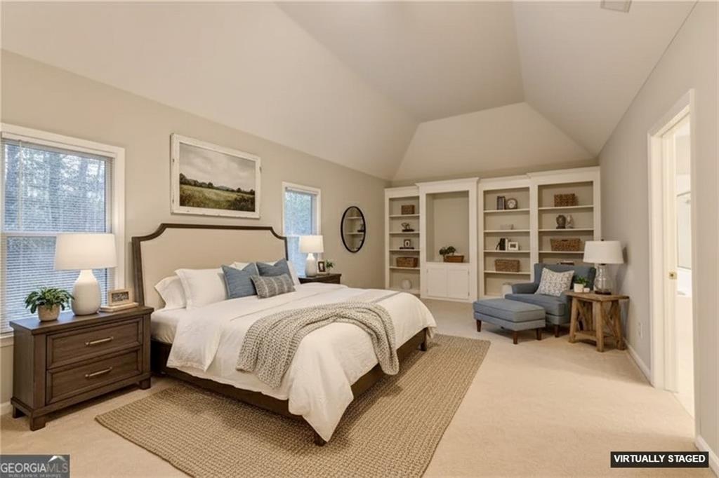 655 Golden Meadows Lane Suwanee, GA 30024 - Photo 29 of 72 a bedroom with a bed and furniture