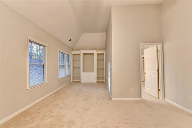 a bathroom with a tub a double vanity sink and a mirror