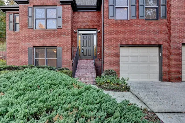 front view of a house with a small yard